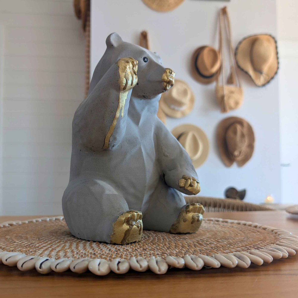 Honey-Dipped Golden Paw Bear Sculpture displayed alongside complementary pieces
