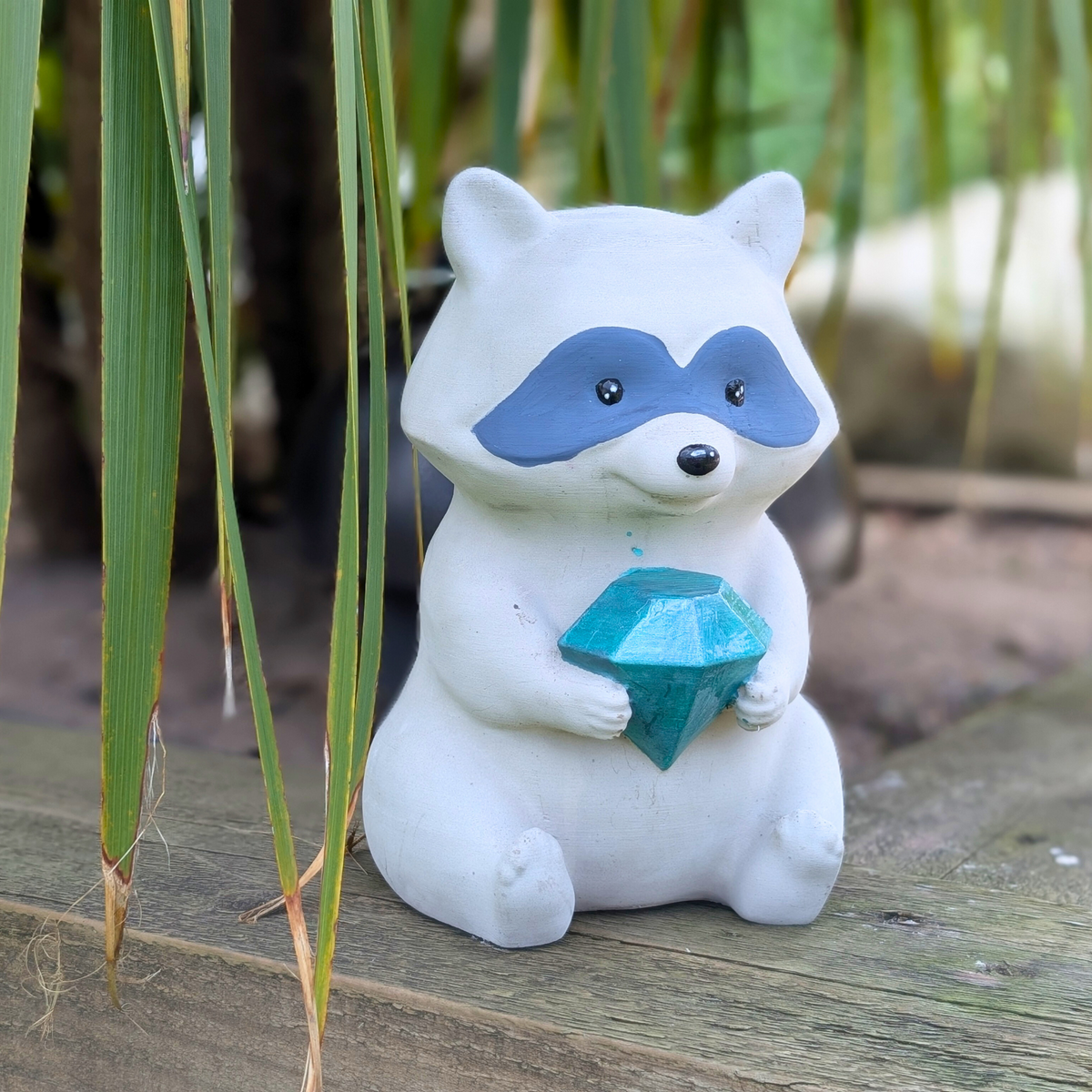 Raccoon Garden Statue side view showing sculpted detail