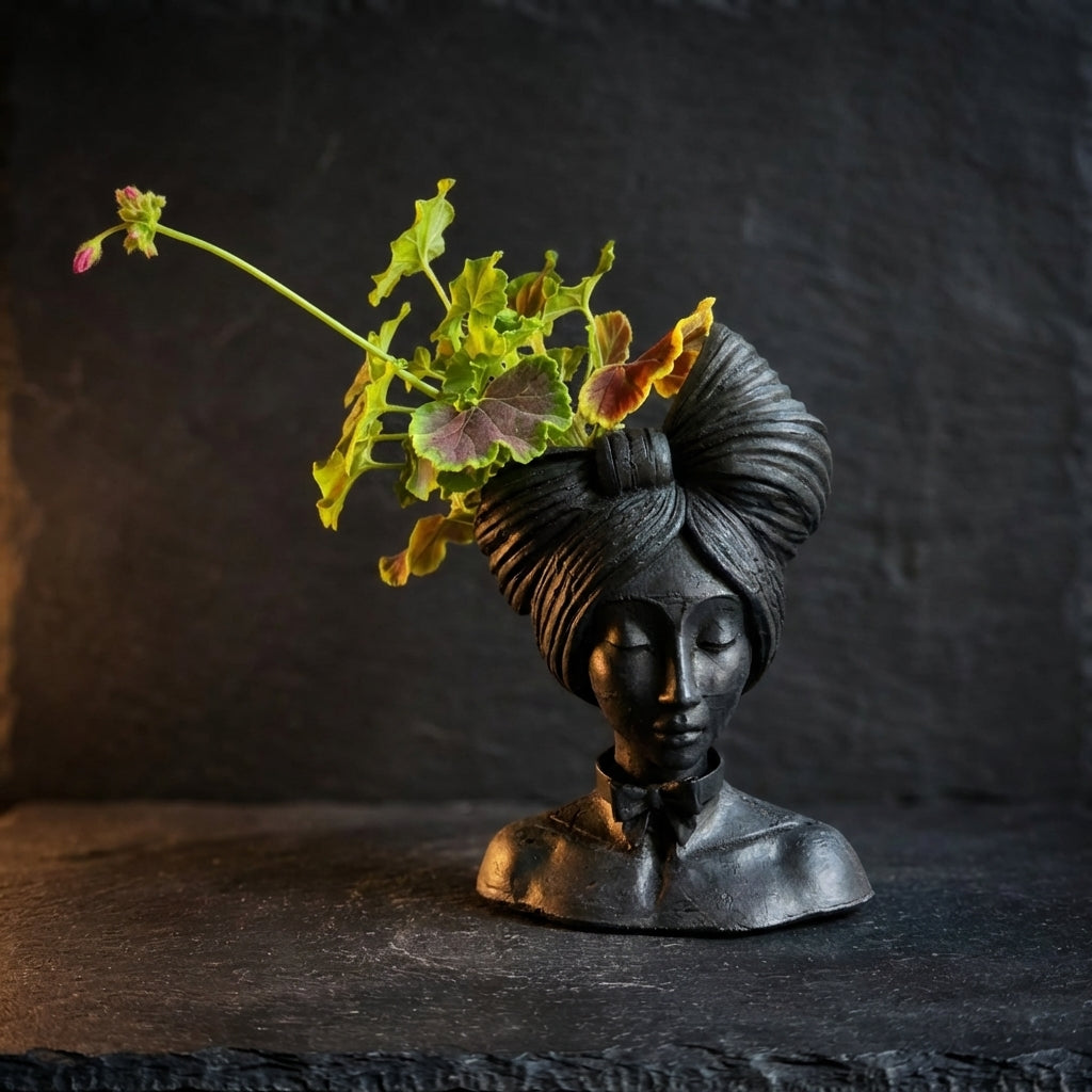 Sable head planter with plant