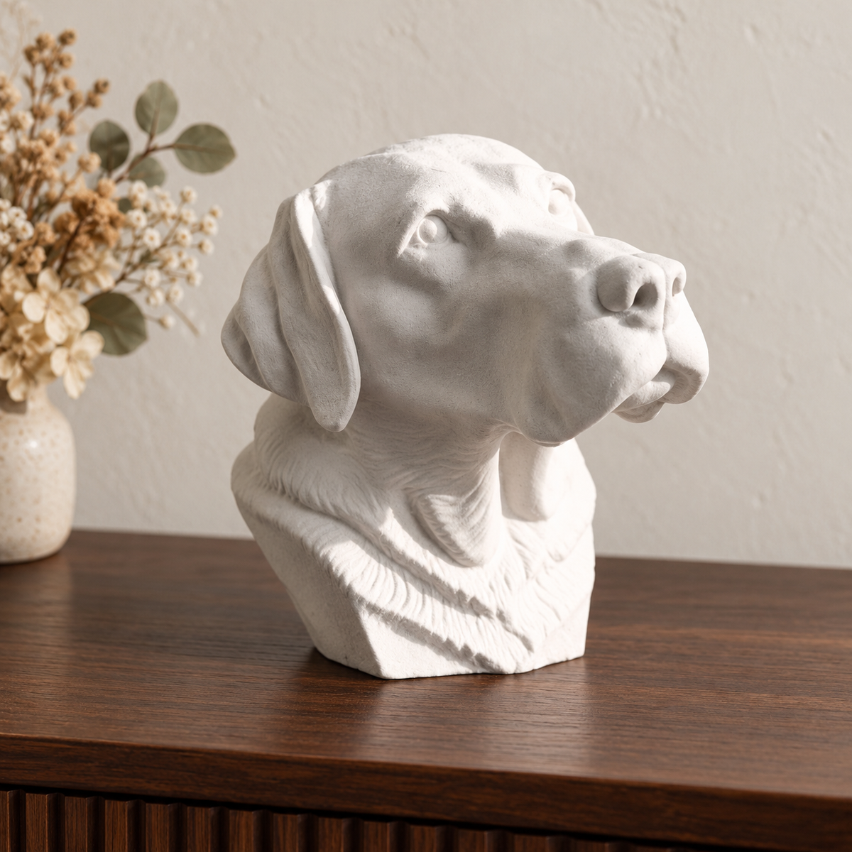 Labrador head urn in chalk off-white on walnut, photographed from three quarters