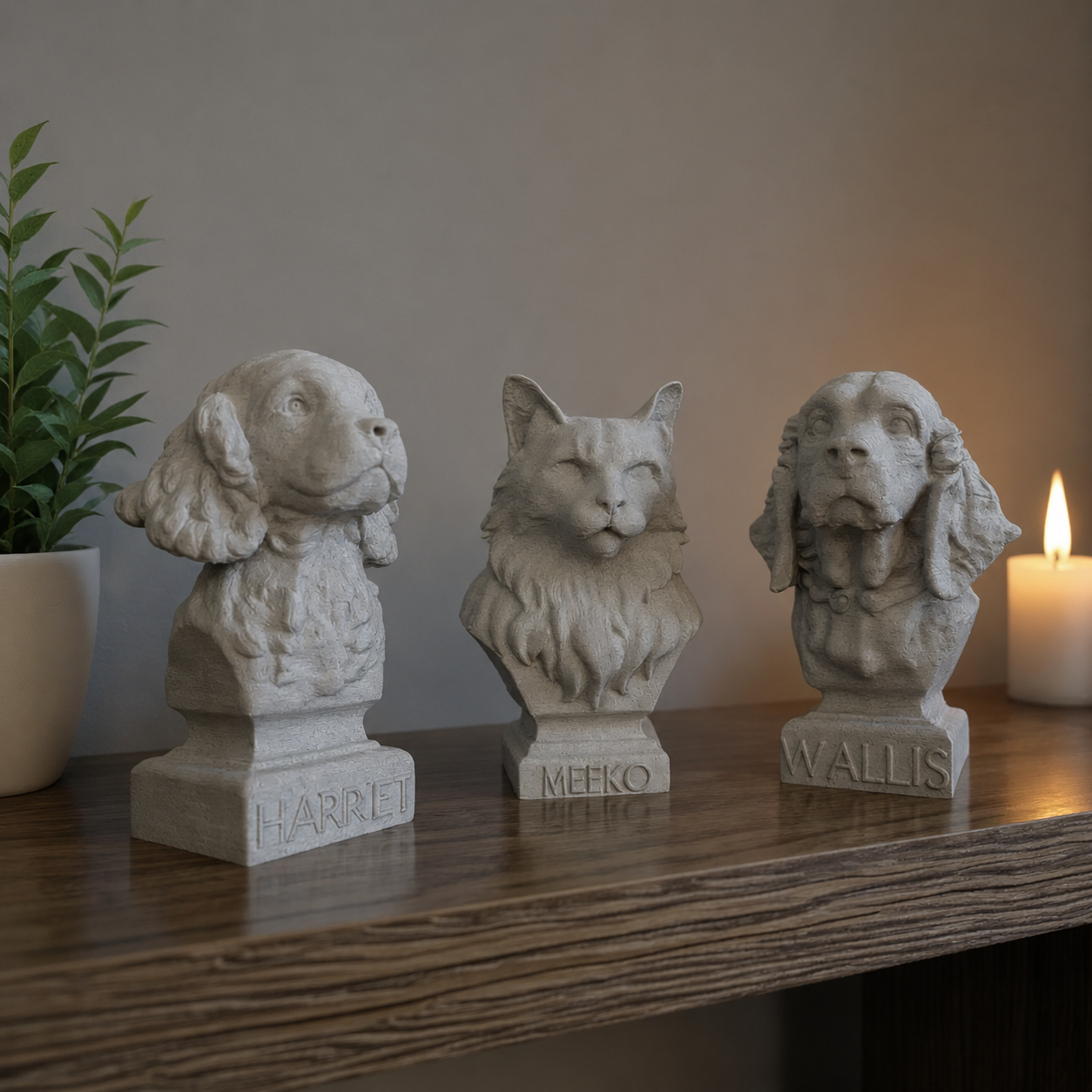Three personalised pet portrait sculptures on a wooden shelf