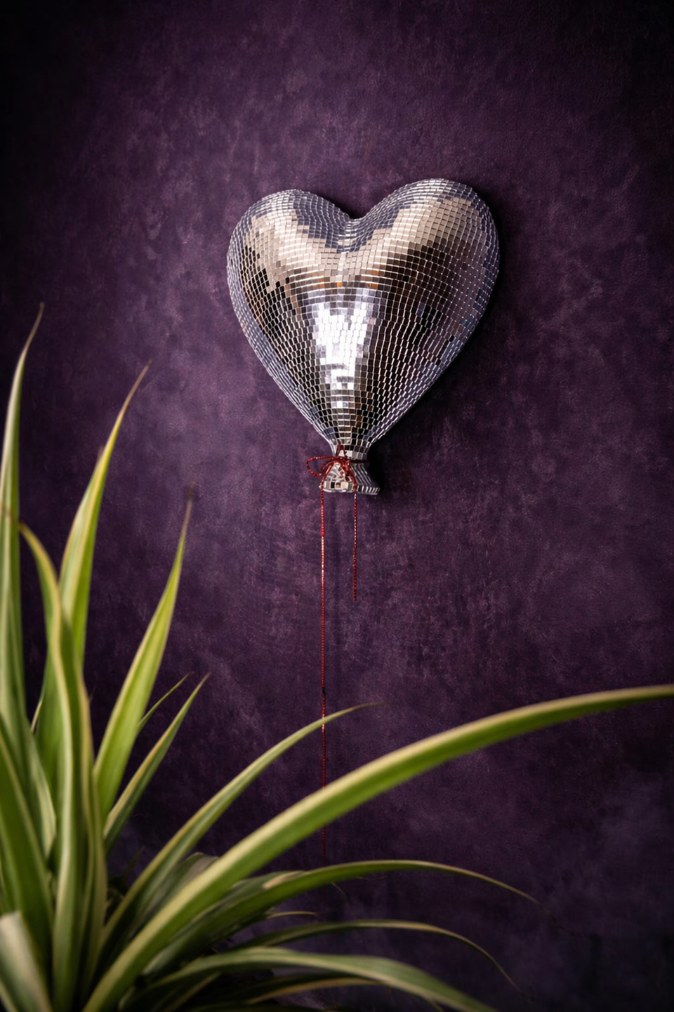 Heartthrob mirror ball heart wall art lifestyle with plant