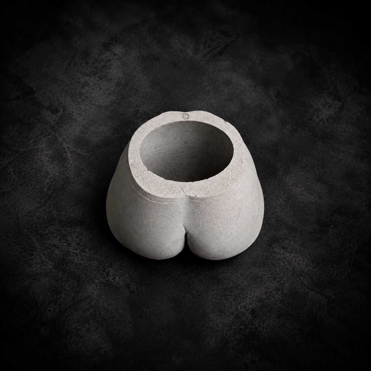 Top view of Cheeky Bum cast stone planter showing 12 cm opening