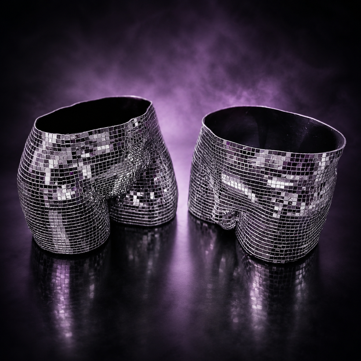 Empty male and female silver disco body planters showing open tops