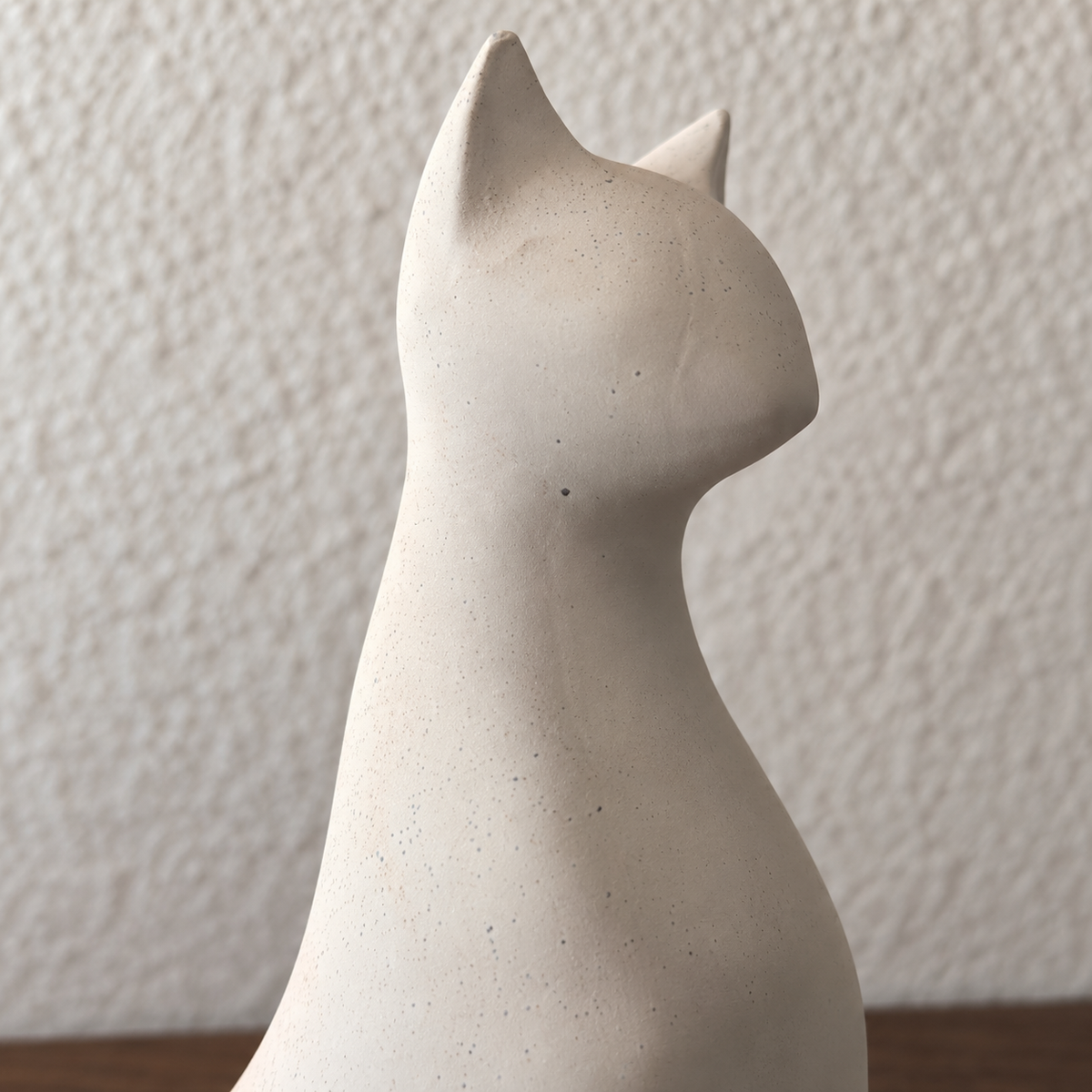Pale modernist cat urn, head and ears detail.