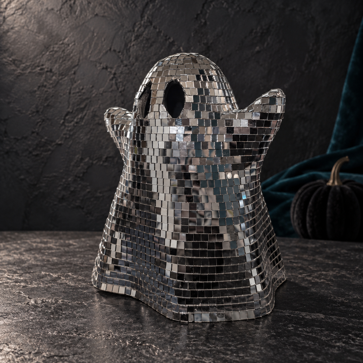 Opposite three-quarter view of the No Bow ghost in a dark Halloween shelf setting.