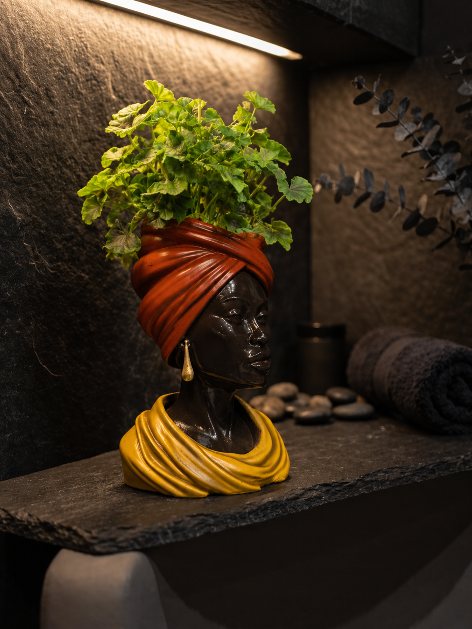 Golden Hour planter styled on dark shelf with plant