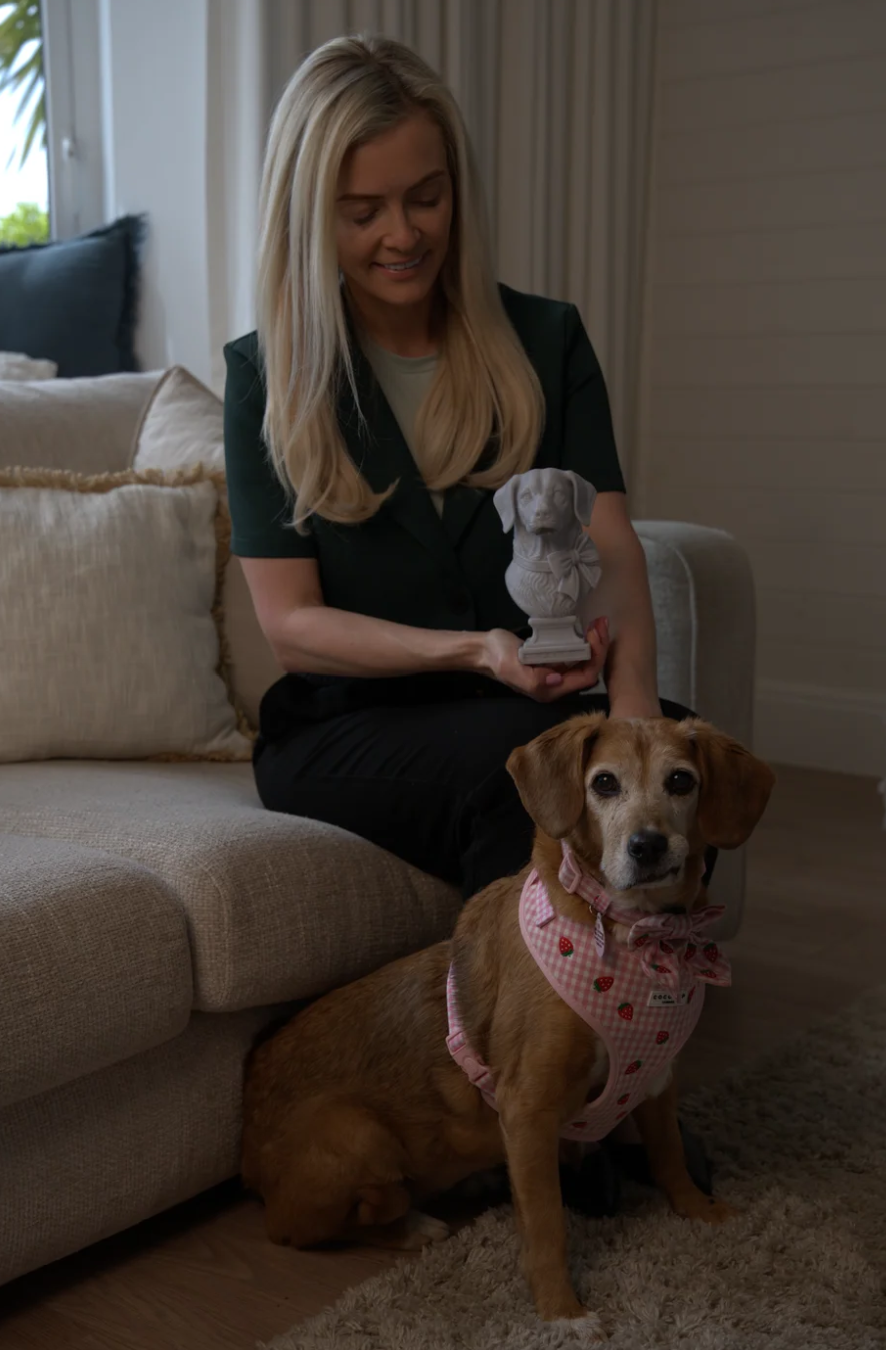 Custom pet bust held with dog for scale