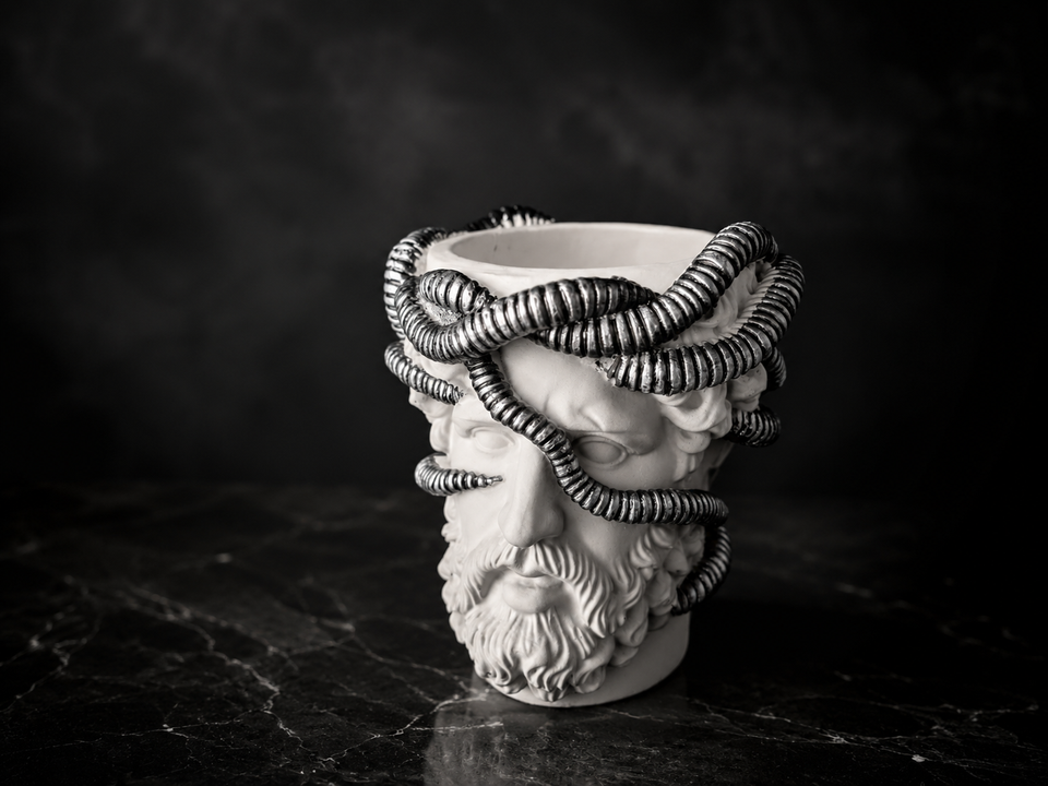 Three quarter studio view of Aristotle.exe cast stone plant pot
