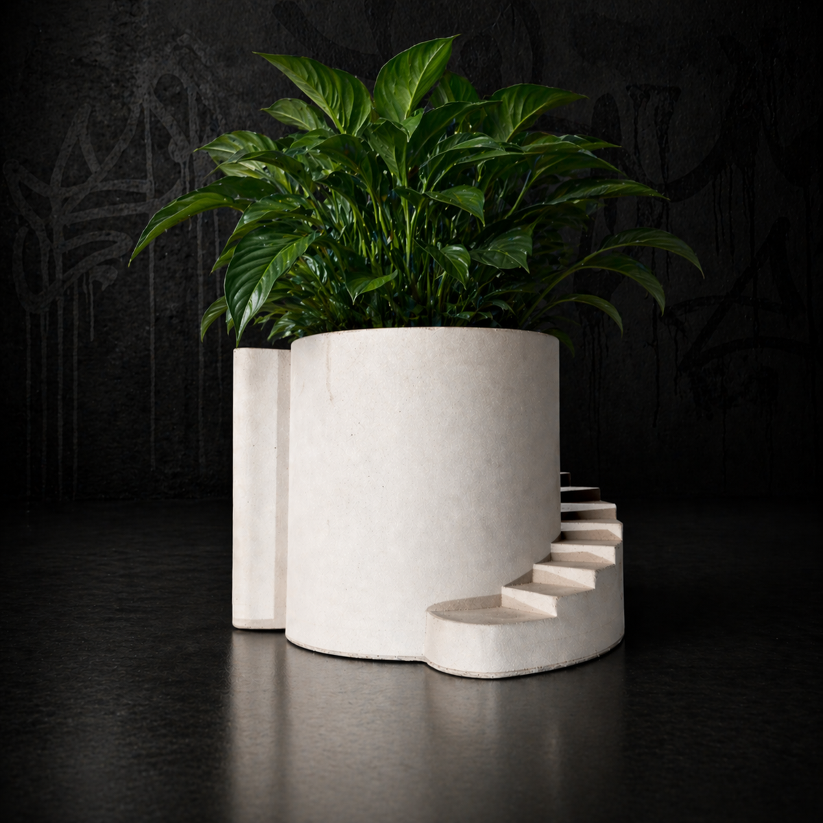 Stairwell cast stone planter with leafy planted arrangement hero thumbnail