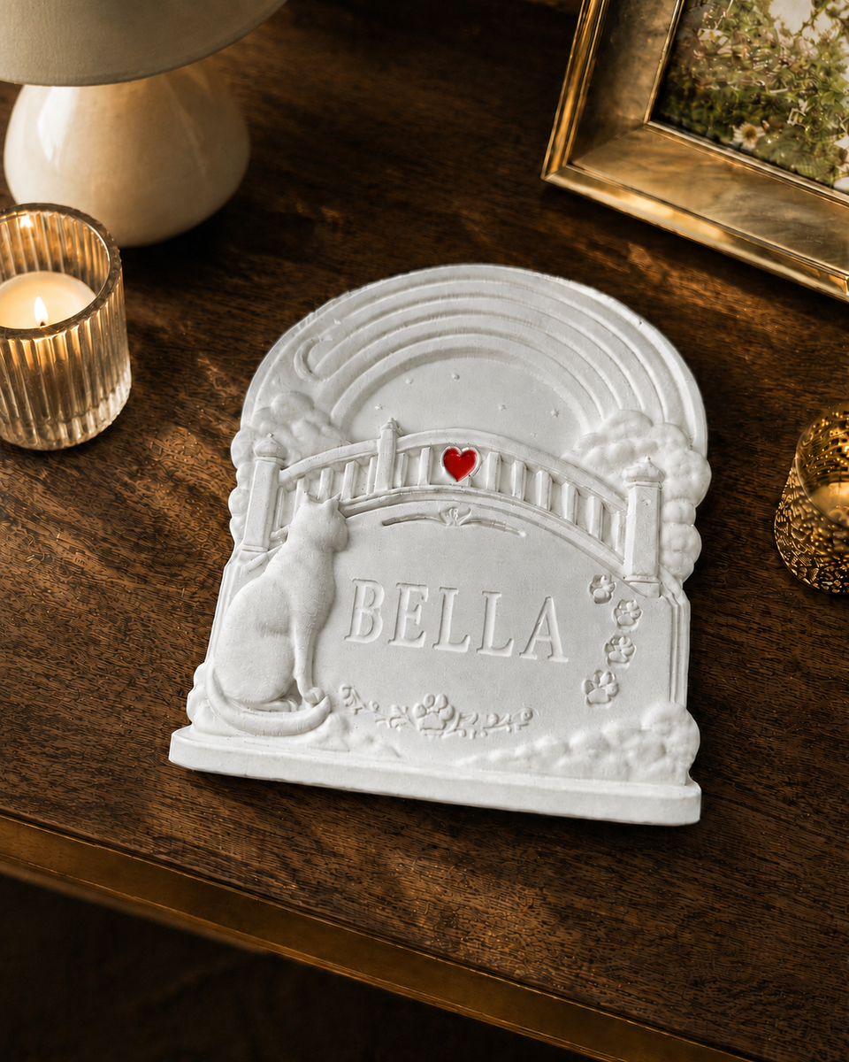 Personalised Rainbow Bridge cat grave marker displayed indoors on a wooden table