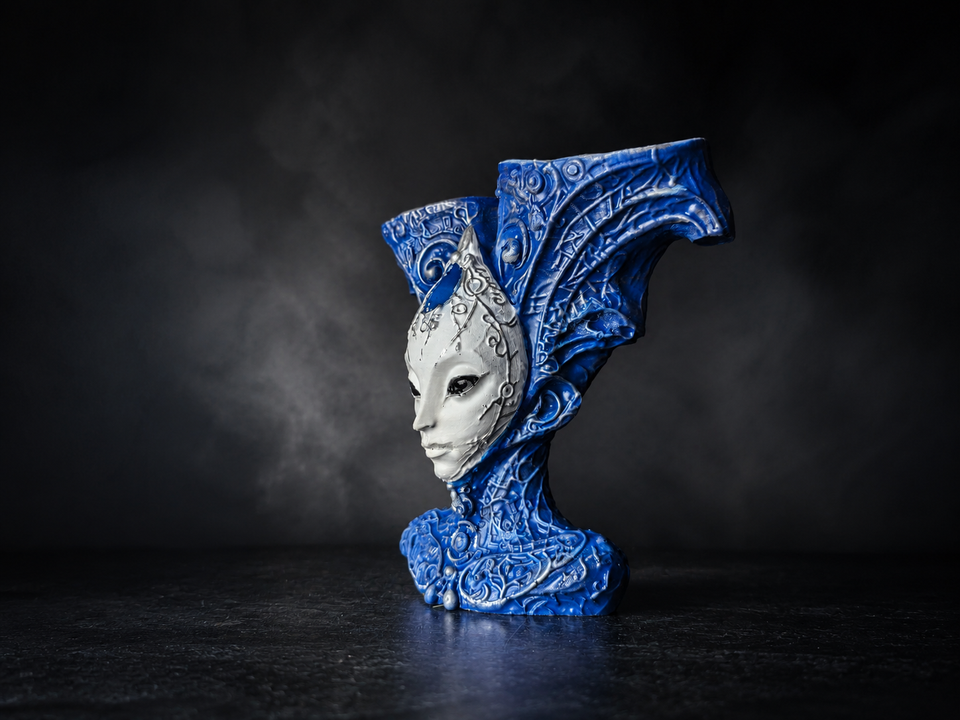 Side studio view of The Blue Trickster alien bust planter