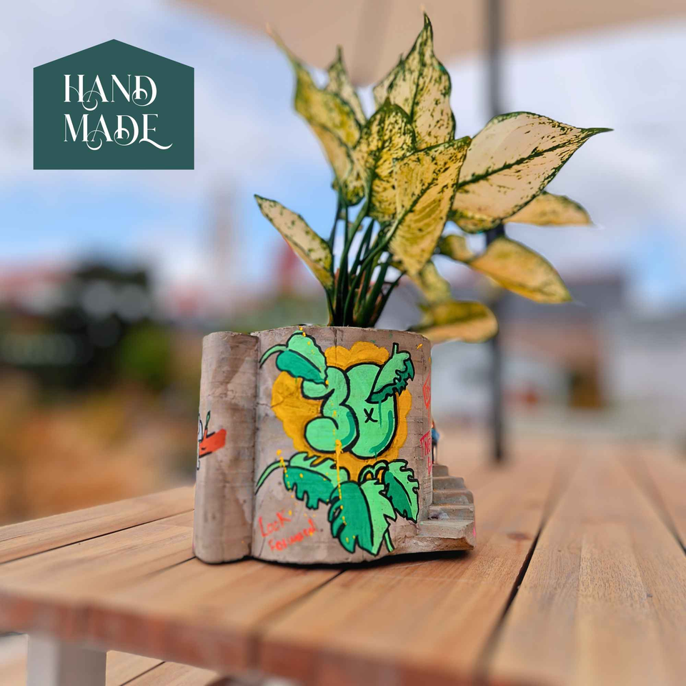 Statement Graffiti Planter - Unique Home Decor for Urban Aesthetics displayed alongside complementary pieces