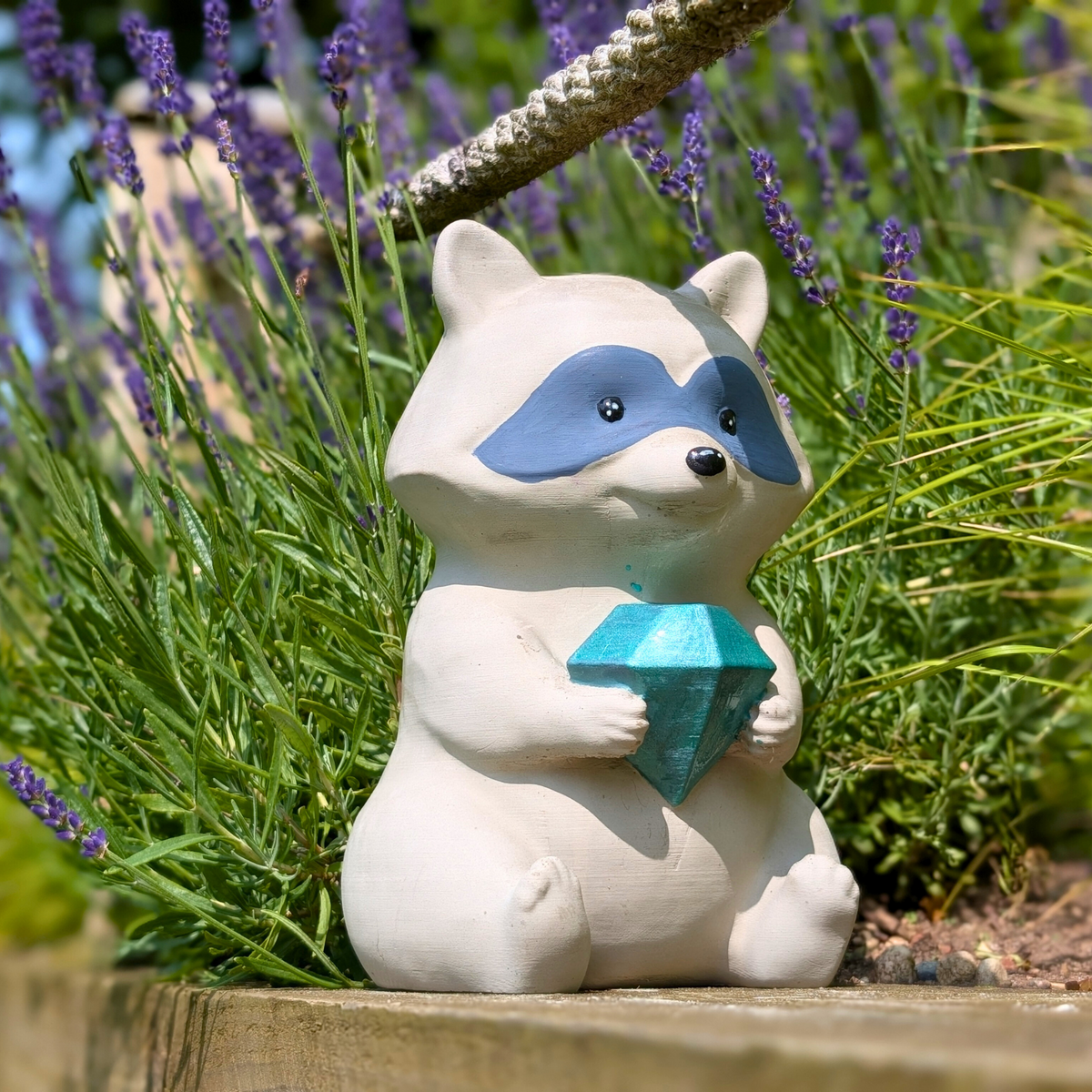 Raccoon Garden Statue texture close-up showing cast stone finish