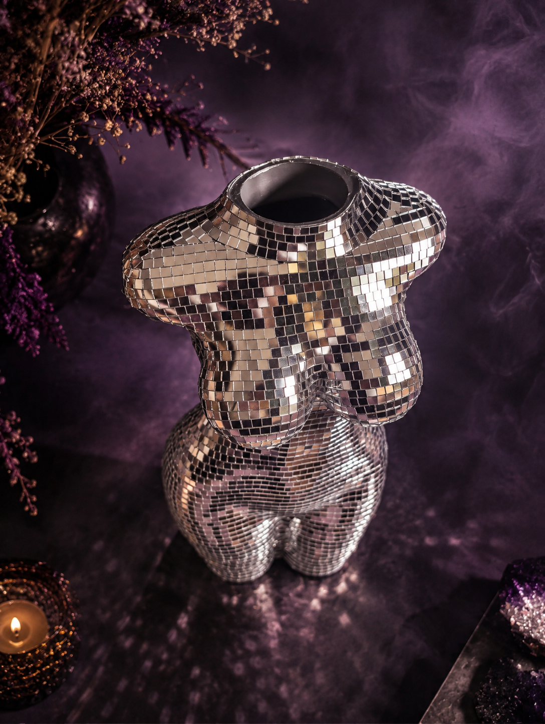 Silver torso vase viewed from above to show the flower opening
