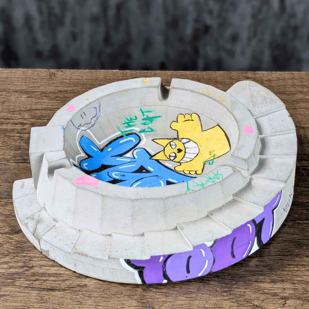 Custom Graffiti Concrete Ashtray displayed alongside complementary pieces