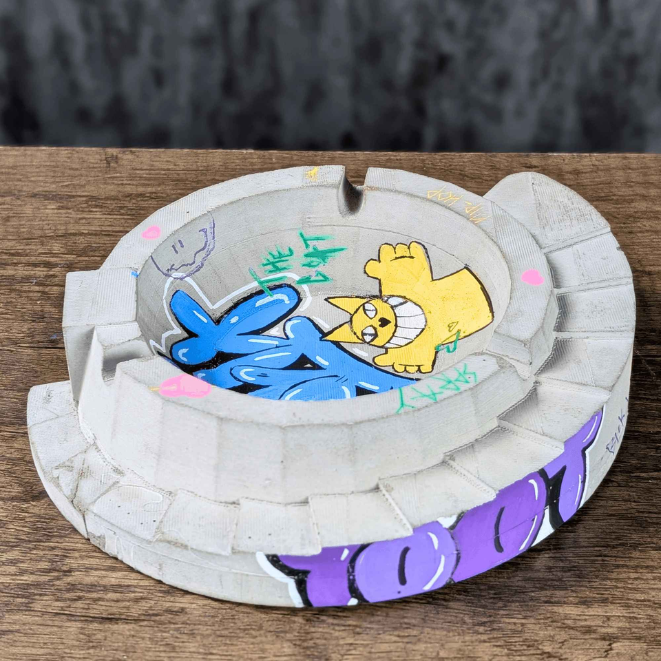 Custom Graffiti Concrete Ashtray displayed alongside complementary pieces