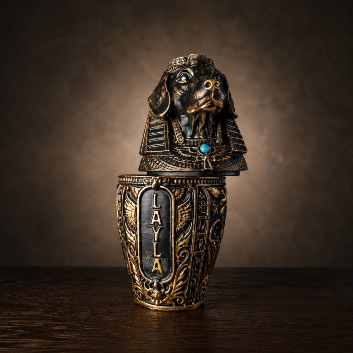 Front view of cast stone canopic pet urn with personalised name panel