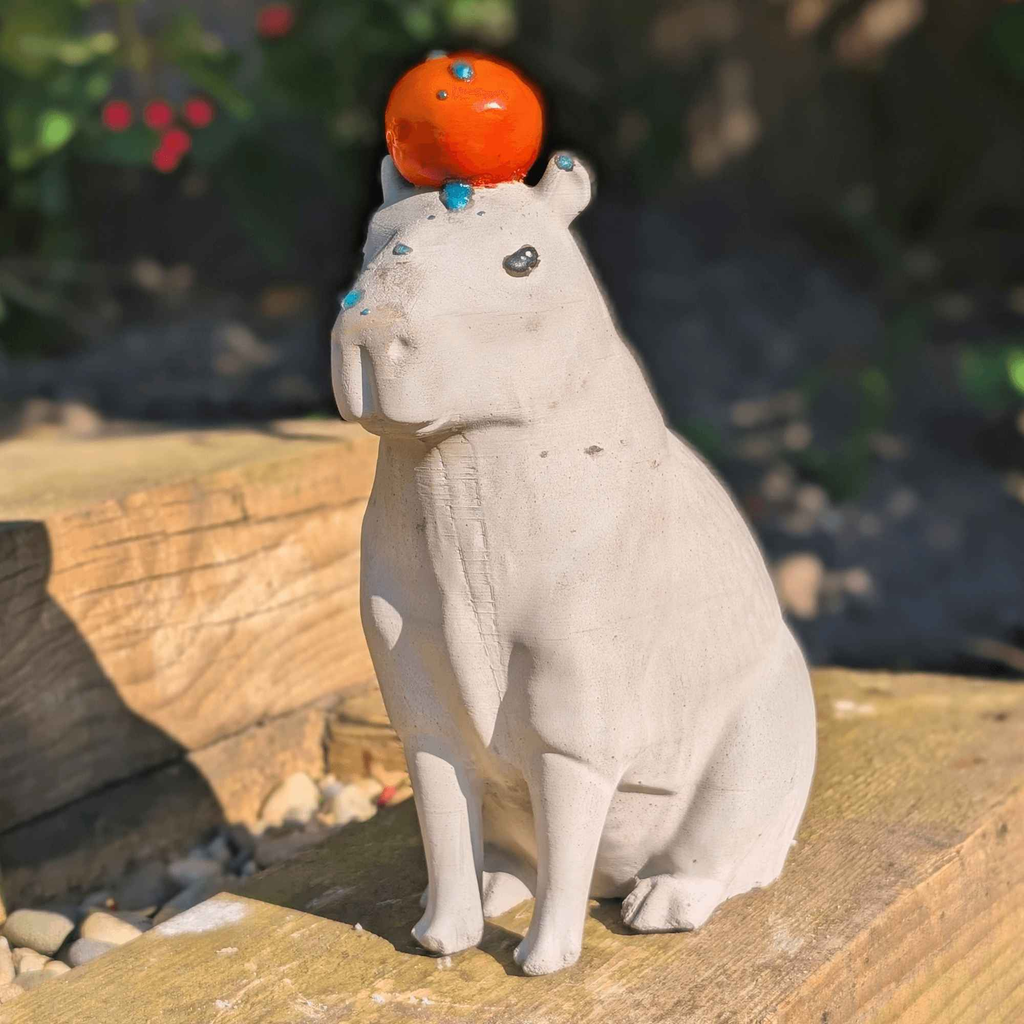 Capybara with Orange Concrete Sculpture