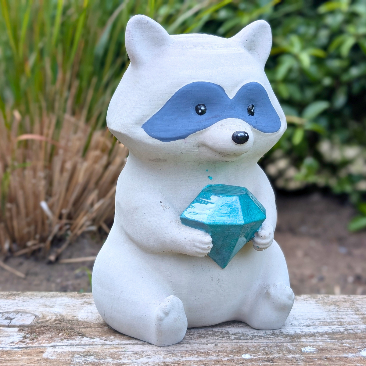 Raccoon Garden Statue styled in home setting