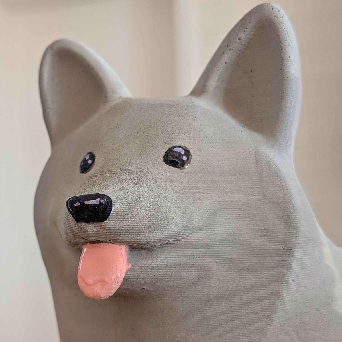 Corgi Garden Ornament: close-up of grey corgi face and tongue