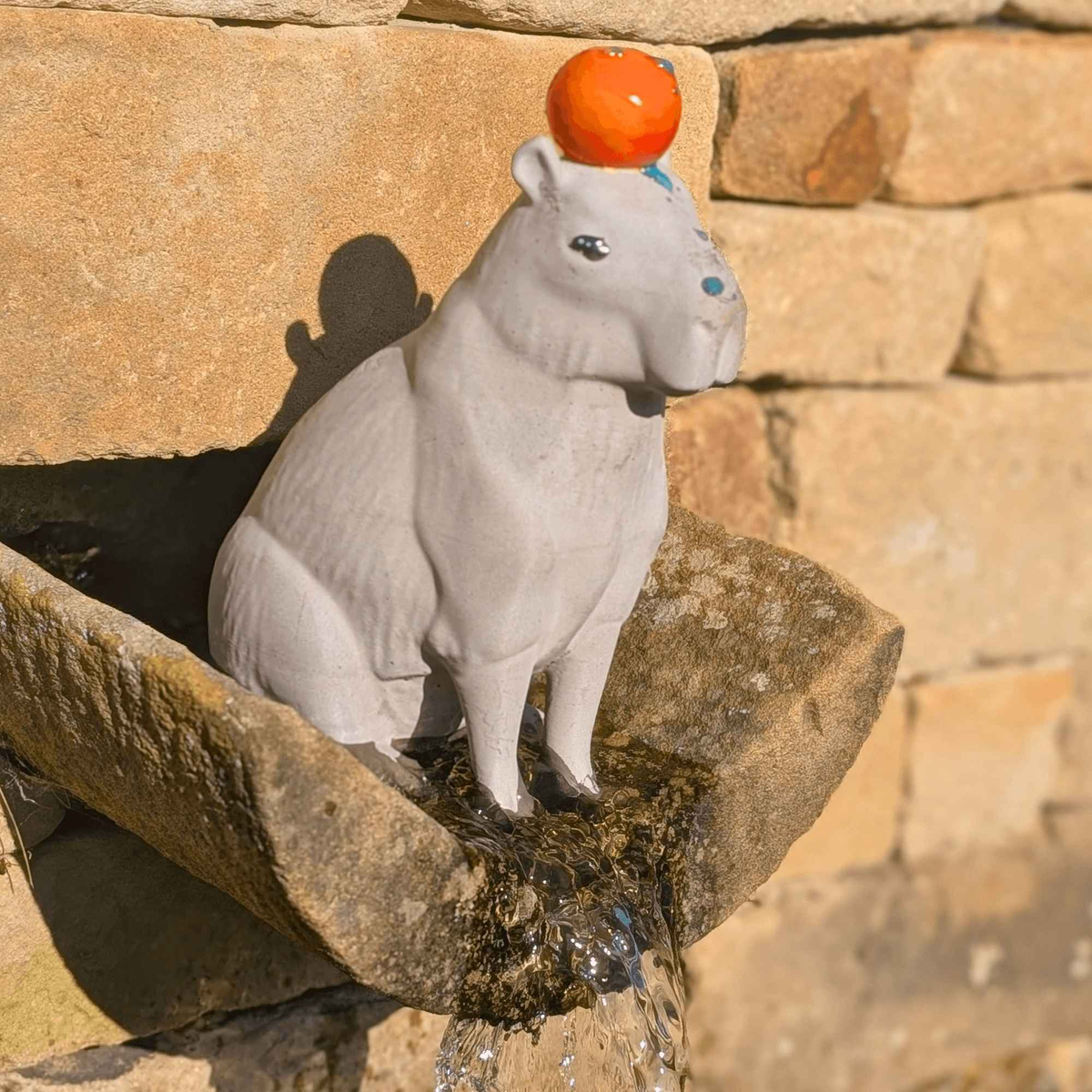Capybara with Orange Concrete Sculpture