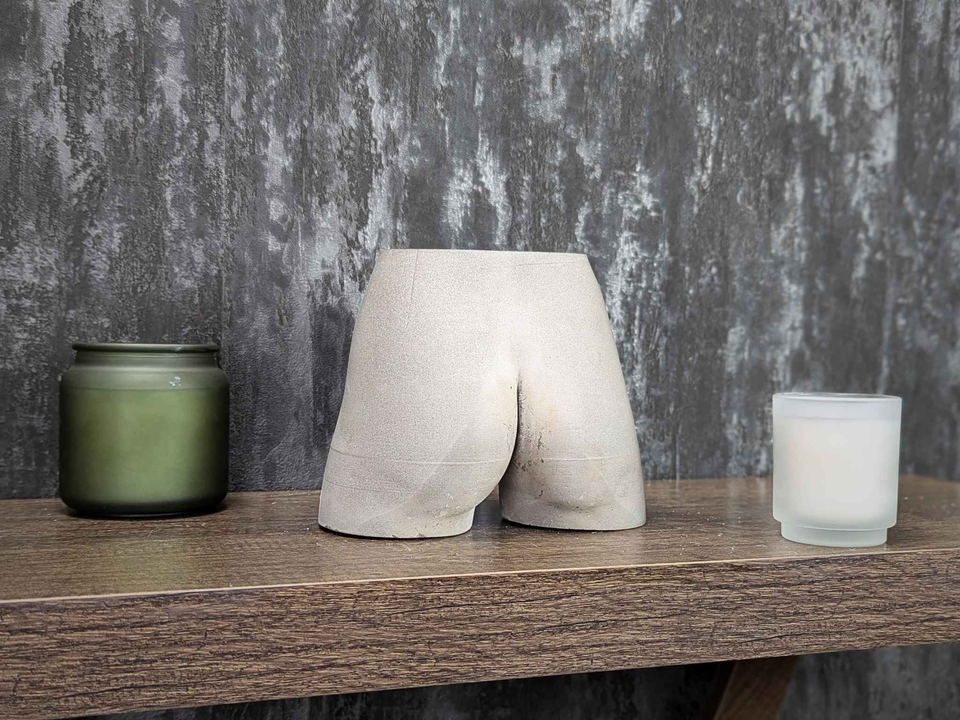 Cheeky Bum Cast Stone Planter — scale reference — shown with plant