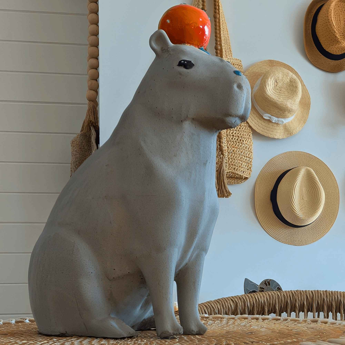 Capybara with Orange Concrete Sculpture displayed alongside complementary pieces