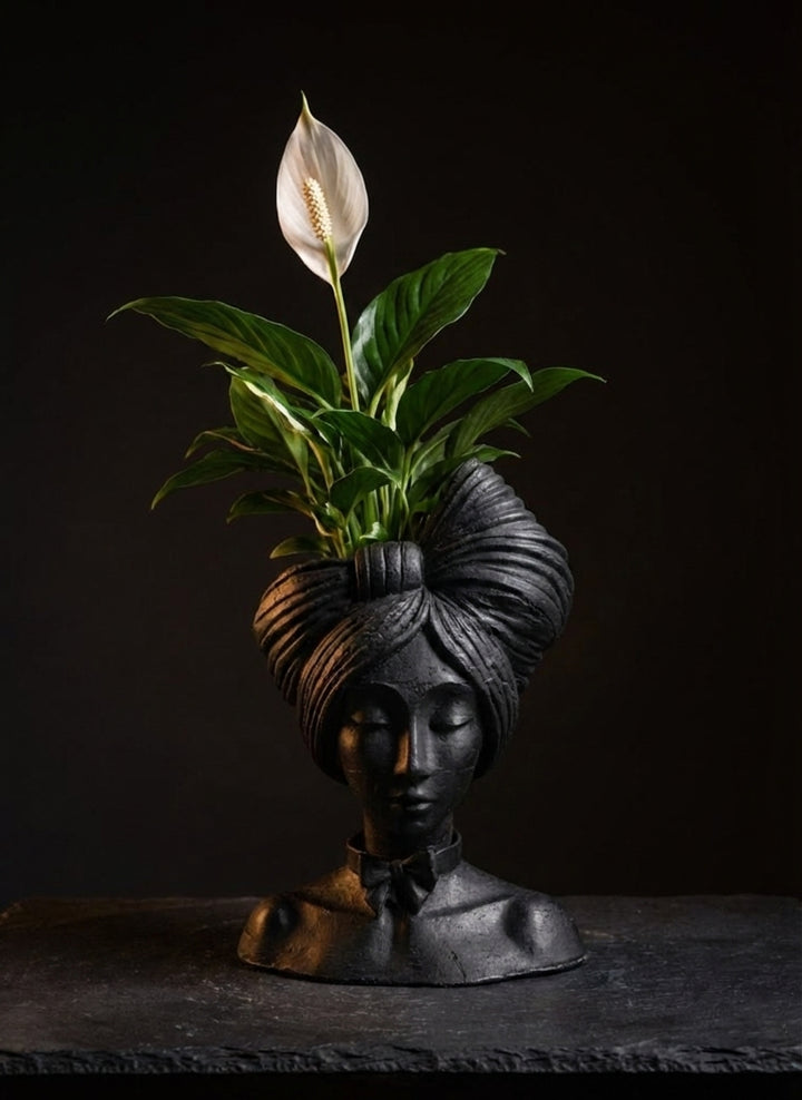 Black woman head planter with peace lily