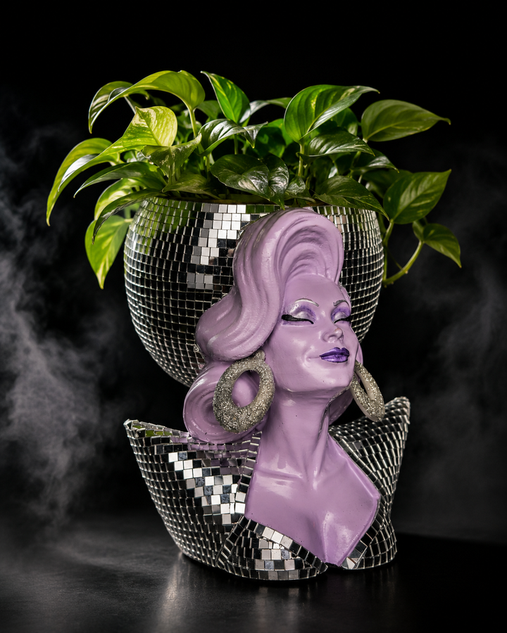 Mother Mirrorball drag queen planter styled with a green trailing plant