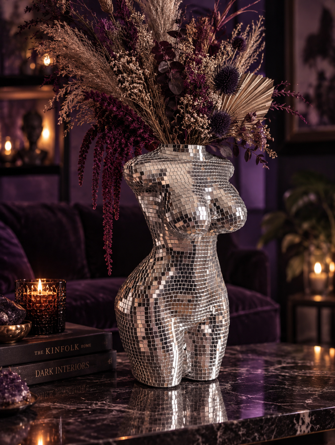 Large silver torso vase in a styled room with flowers; styling accessories not included