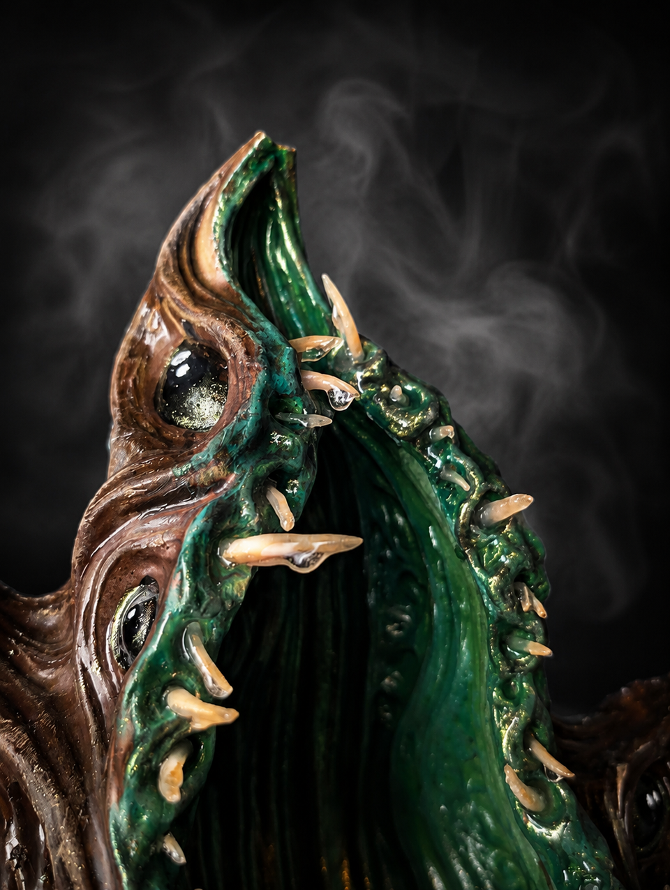 Close view into The Watching Maw green planting cavity and sculpted teeth