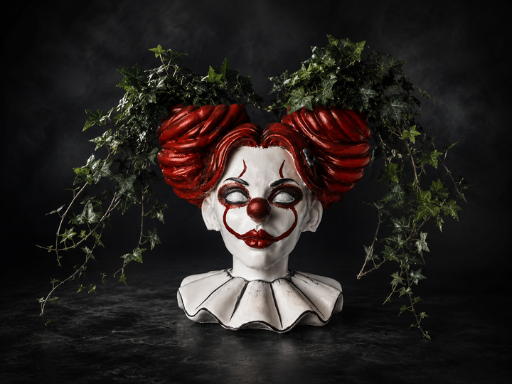 The Last Laugh hand-painted cast stone horror clown planter with trailing ivy in twin planting bowls