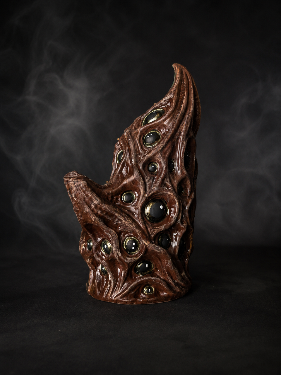 Side profile of The Watching Maw showing sculpted ridges and glossy eyes