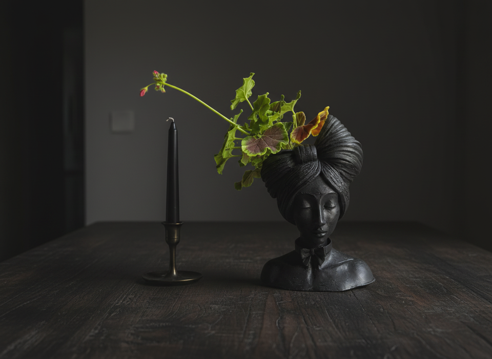 Matte black head planter in dining room