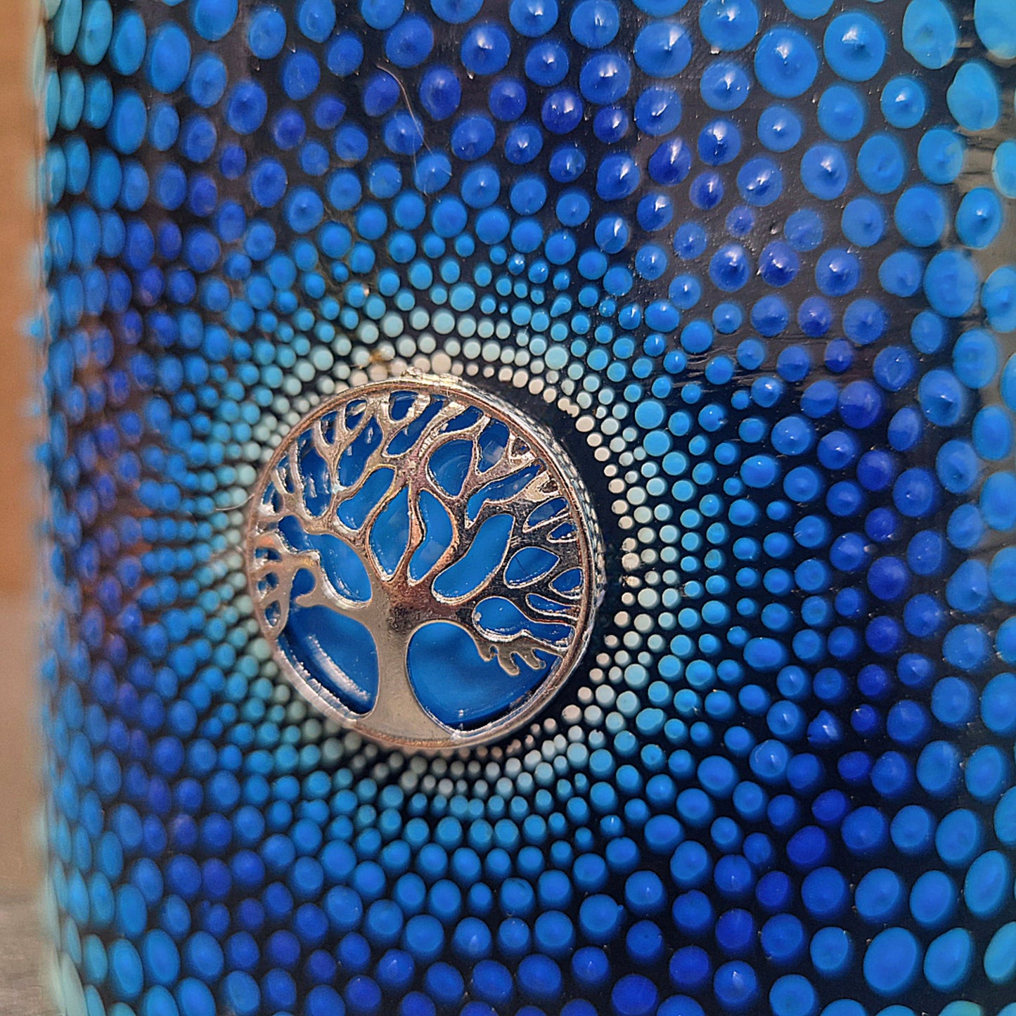 a blue and white clock on a blue surface 