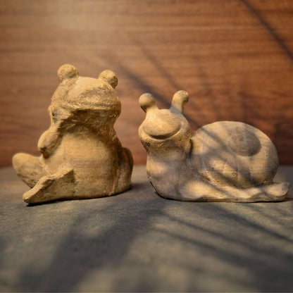 a group of stuffed animals sitting on top of a bed 