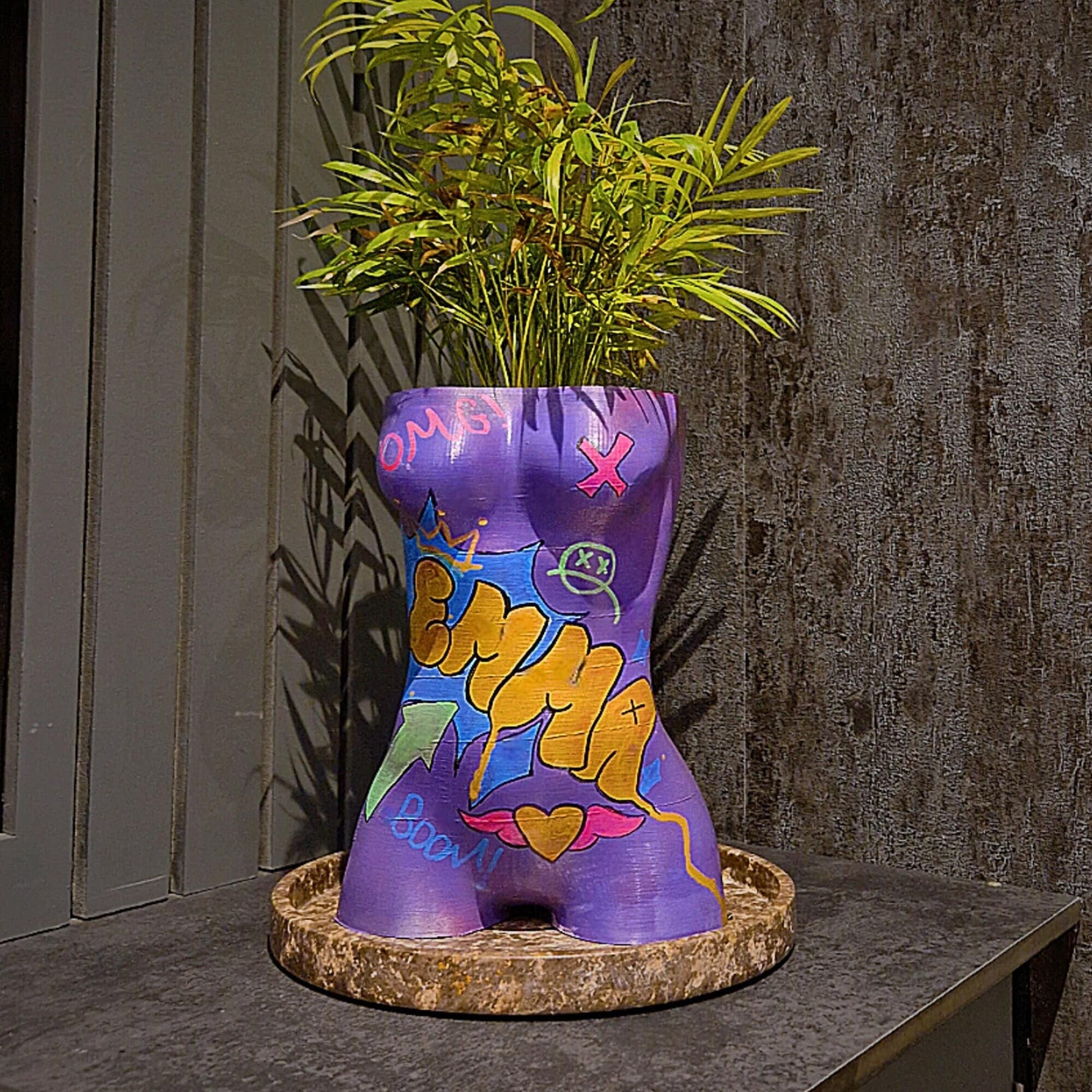 a purple vase filled with purple and purple flowers 