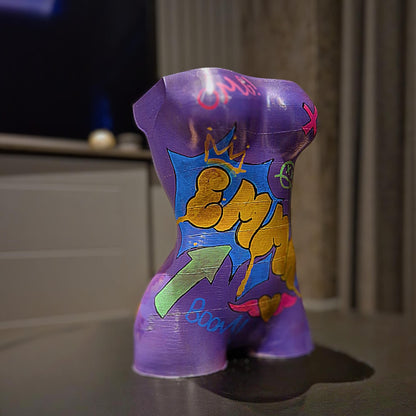 a purple vase sitting on top of a table 