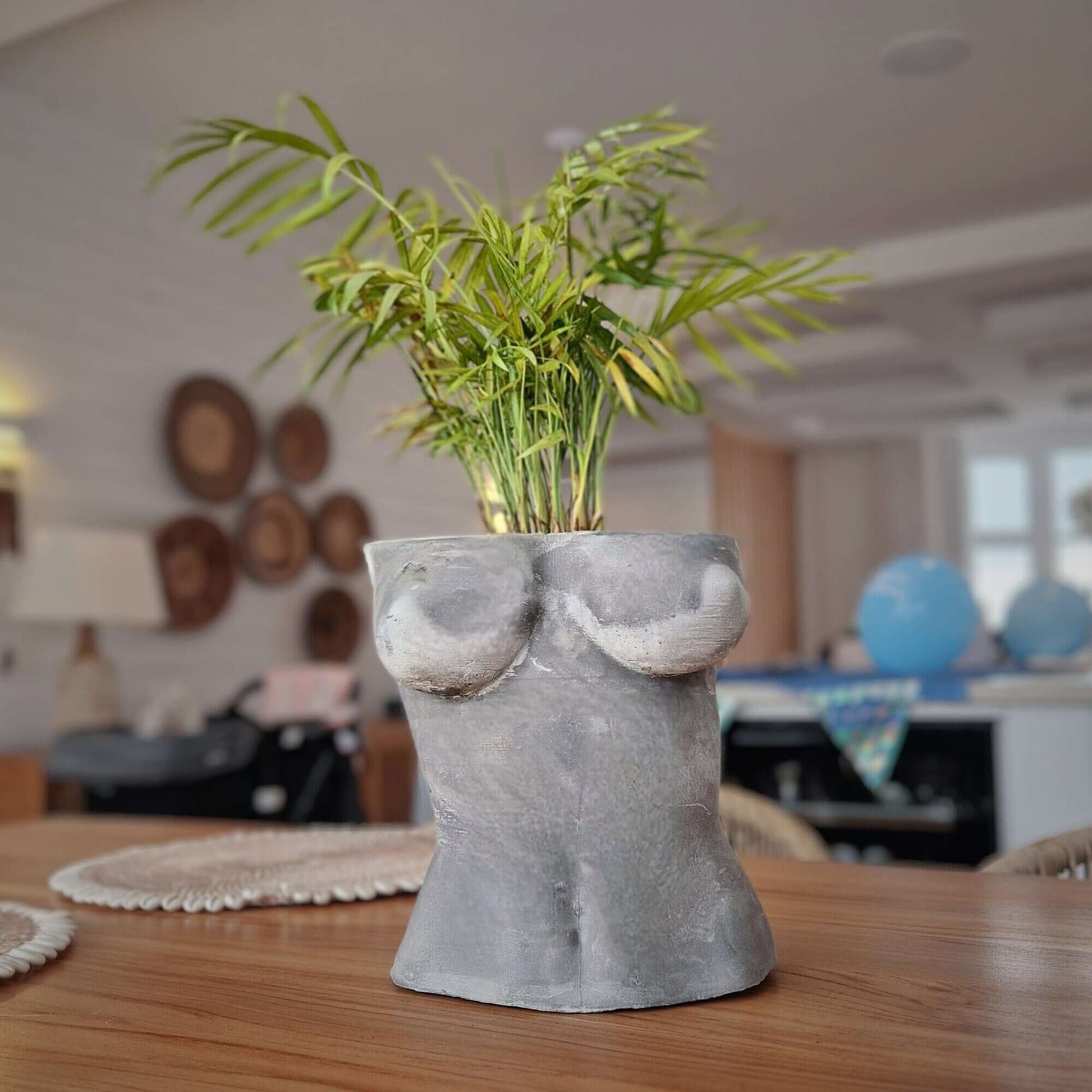 a vase of flowers sitting on a table 