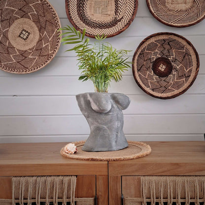 a clock sitting on top of a wooden shelf 