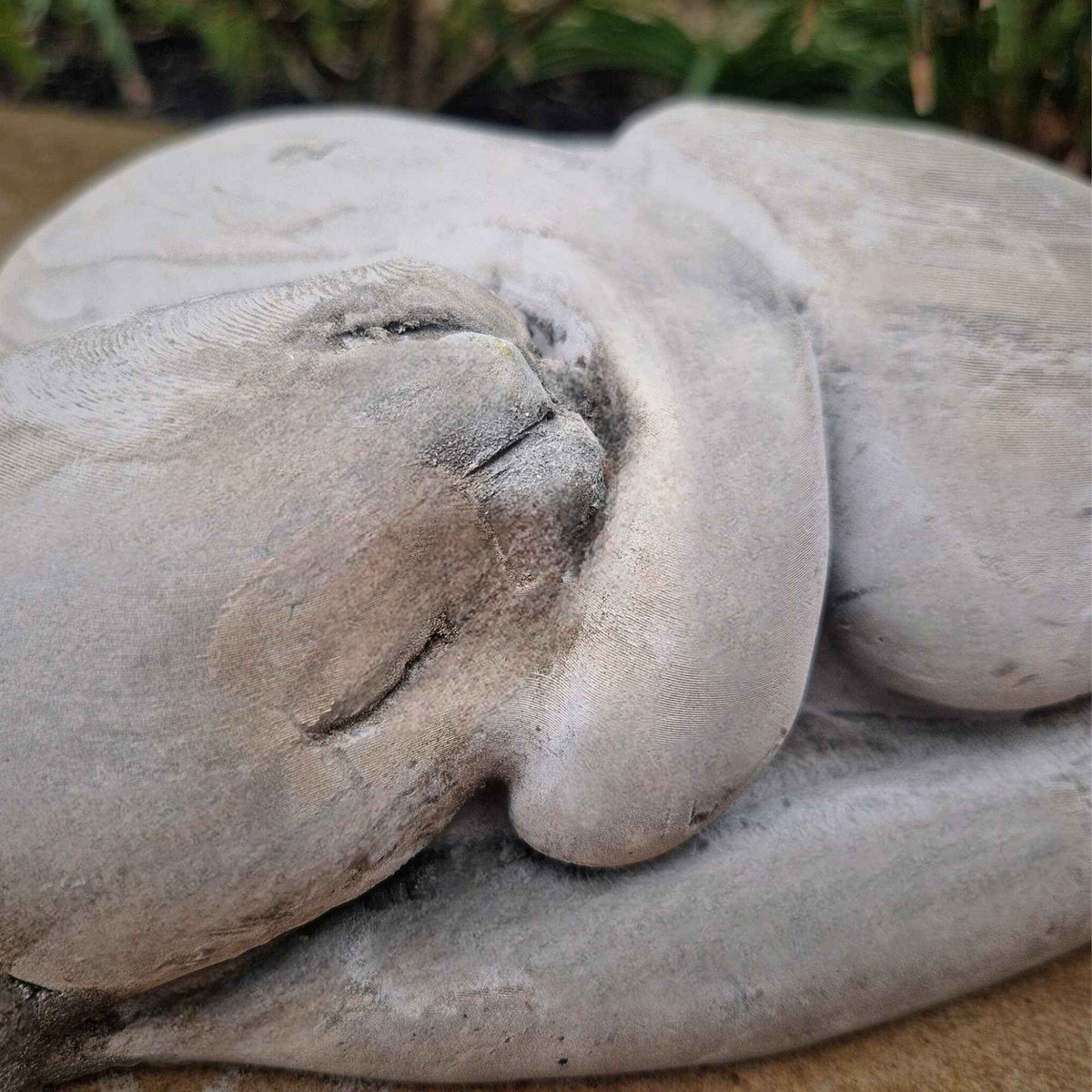 Sleeping Cat Garden Statue styled in home setting