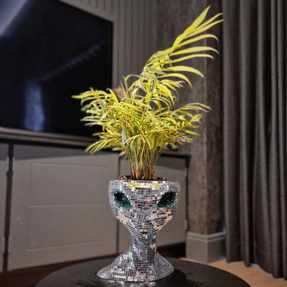 a vase of flowers sitting on a table 