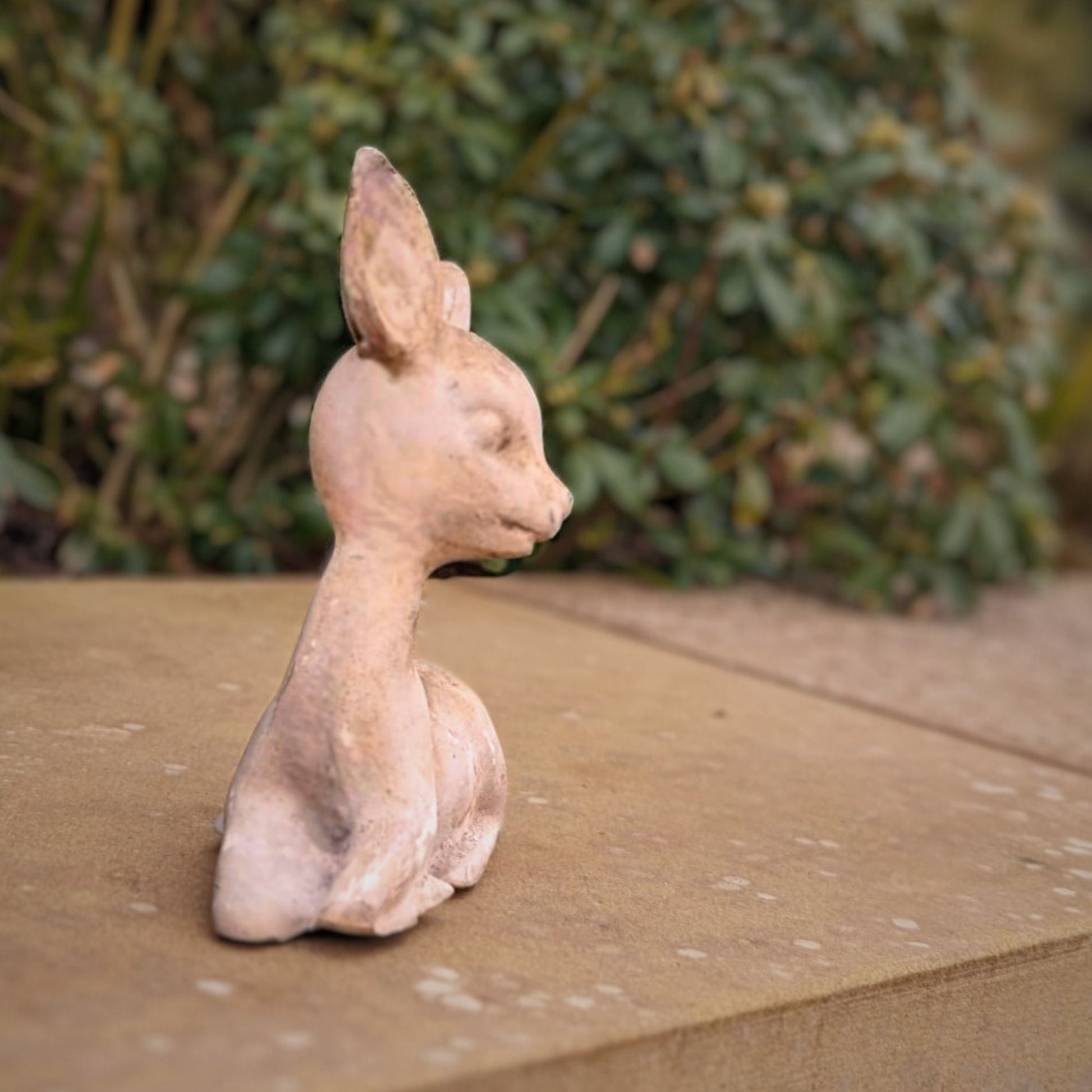 a bunny sitting on top of a wooden table 