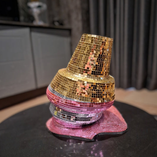 a large pink fire hydrant sitting on a table 