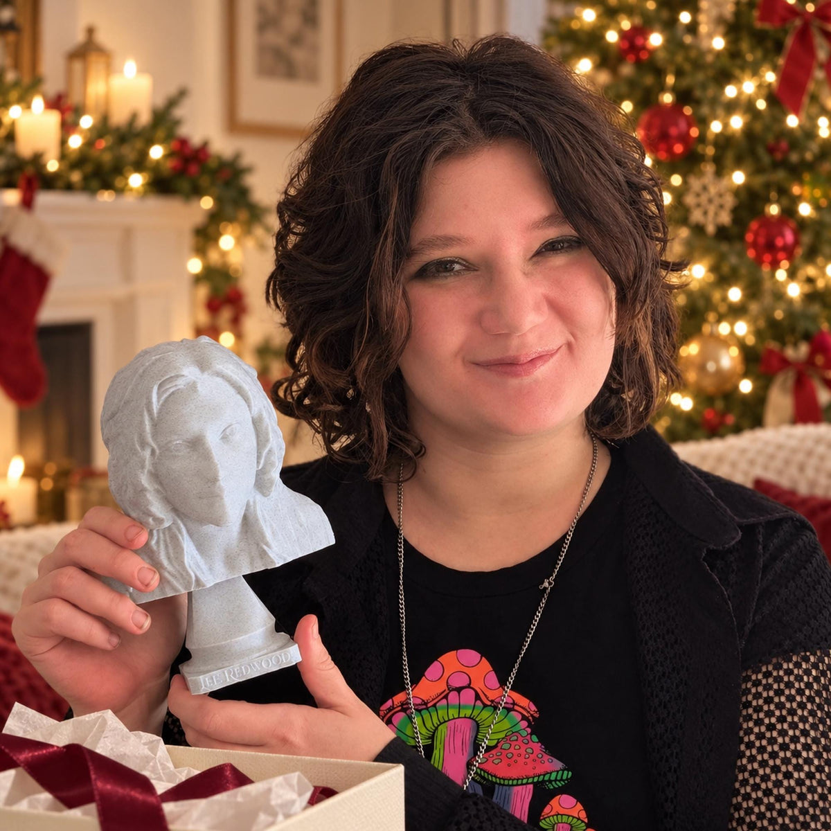 Custom bust sculpture made from a photo, held up beside a Christmas gift box