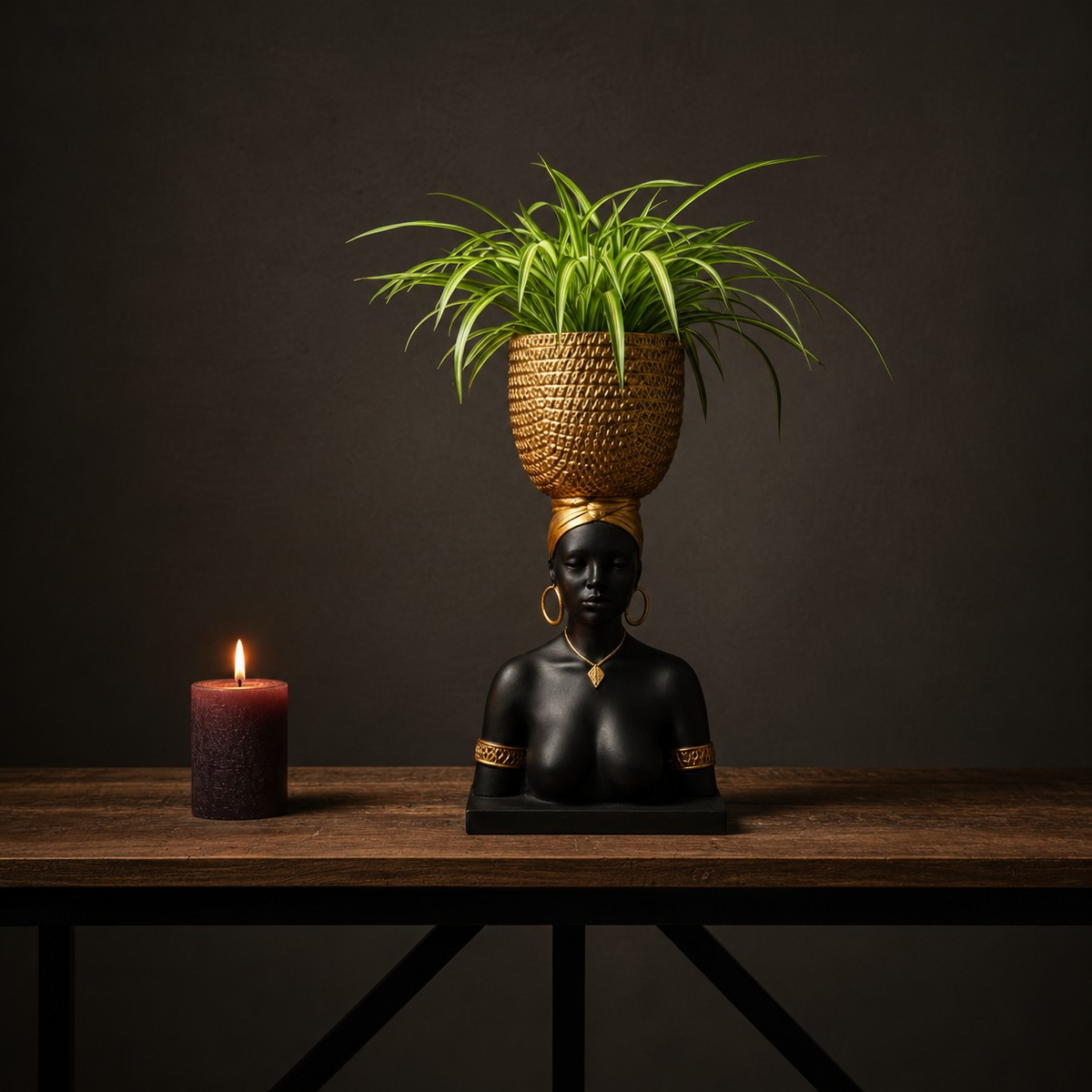 Harvest Goddess planter with spider plant on a wooden console beside a candle