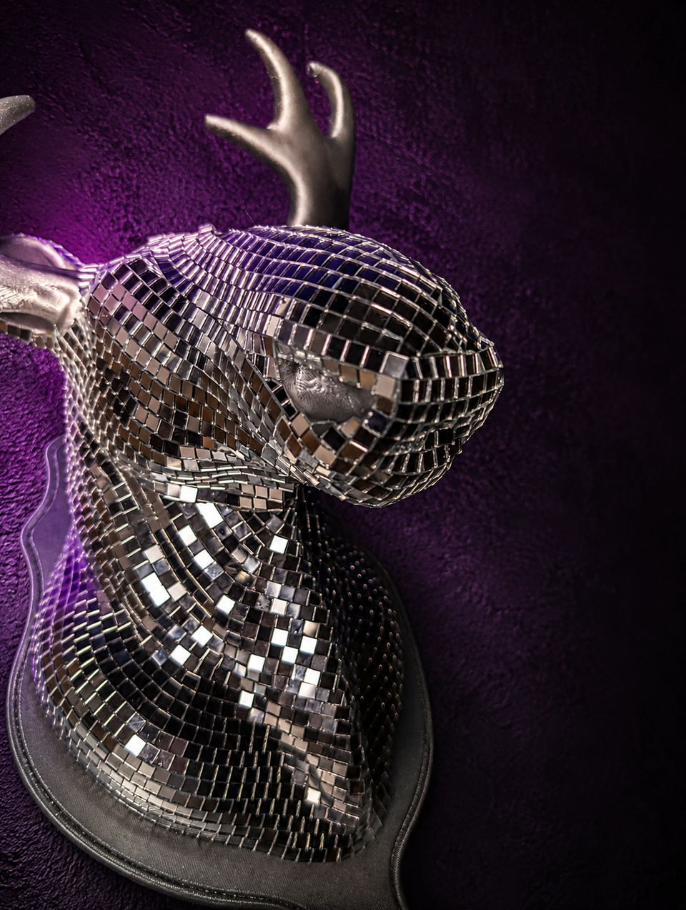 Close up of Mirrorball Moose silver mirror tiles and sculpted antler detail