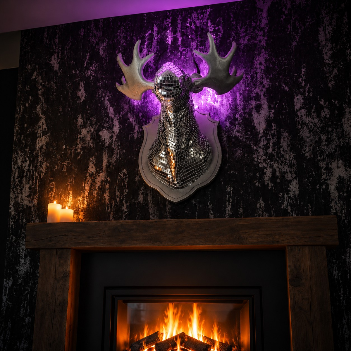 Mirrorball Moose wall art displayed above a dark fireplace mantel