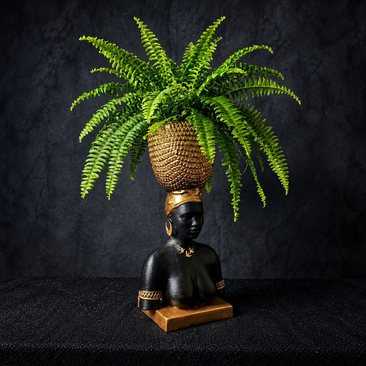 Harvest Goddess cast stone planter displayed with a trailing fern